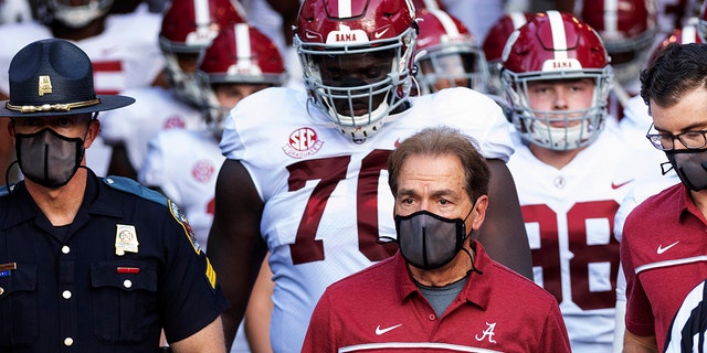 In this Sept. 26, 2020, file photo, Alabama coach Nick Saban leads his team to the field before an NCAA college football game against Missouri in Columbia, Mo. (AP Photo/L.G. Patterson, File)