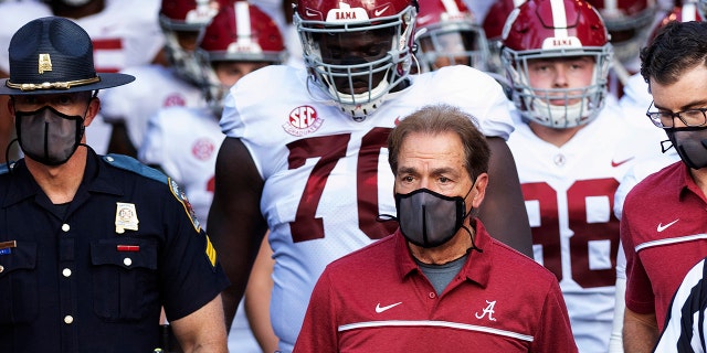 In this Sept. 26, 2020, file photo, Alabama coach Nick Saban leads his team to the field before an NCAA college football game against Missouri in Columbia, Mo. (AP Photo/L.G. Patterson, File)