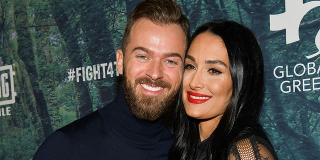 Artem Chigvintsev (left) and Nikki Bella will tie the knot in November 2021.