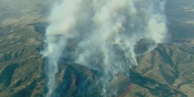 The Silverado Fire rapidly grew to 2,000 acres Monday in Orange County, Calif., driven by gusty winds.