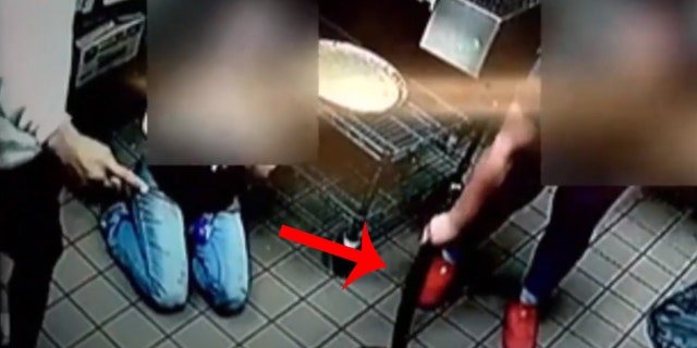 The employee picked up a pizza cutter that the criminals had wrestled away from one of the other workers.