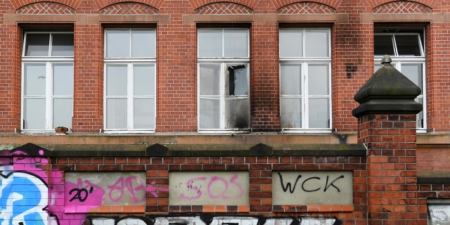 A broken window is pictured at the Robert Koch Institute (RKI) for infectious disease in General-Pape-Strasse, as the coronavirus disease (COVID-19) outbreak continues, in Berlin, Germany, October 25, 2020. (Reuters/Annegret Hilse)