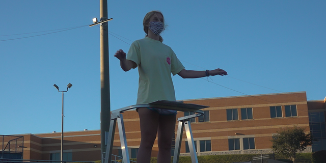 Marching band drum major Bailey Lesko leading practice at Norcross High School. (Source/ Fox News)