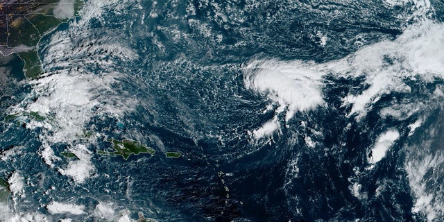 Tropical Depression 26 can be seen swirling over the Atlantic Ocean on Monday, Oct. 19, 2020.