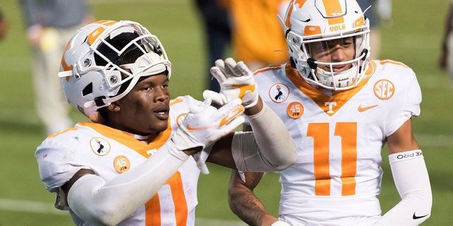 Tennessee defensive back Bryce Thompson (0) and Henry To'o To'o (11) celebrate the team's 31-27 win over South Carolina in an NCAA college football game Saturday, Sept. 26, 2020, in Columbia, S.C. (AP Photo/Sean Rayford)