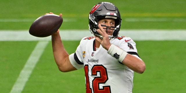 Tampa Bay Buccaneers quarterback Tom Brady (12) throws against the Las Vegas Raiders during the first half of an NFL football game, Sunday, Oct. 25, 2020, in Las Vegas. (AP Photo/David Becker)