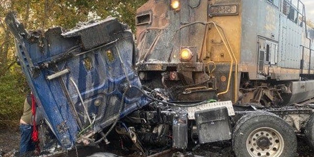 Train slams semi-truck in Indiana after driver gets stuck on tracks ...