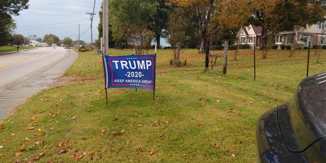 Powell said his other signs had been cut, but he sewed them back together and reinstalled them on his property.