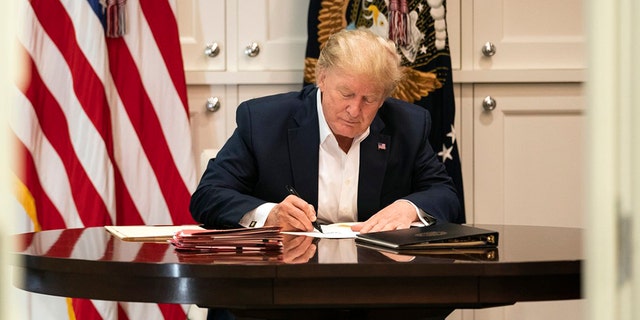 President Trump works inside Walter Reed National Military Medical Center in Bethesda, Md., where he has been receiving treatment for the coronavirus. (White House photo)