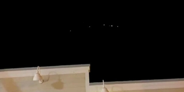 Video grab from the footage of the lights in the night sky above Splasher's Grill in Kailua-Kona, Hawaii, at 8.50pm on Oct. 24 2020.