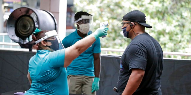 Universal Orlando Resort held a soft reopening in early June before admitting the public back to its parks. (AP Photo/John Raoux)