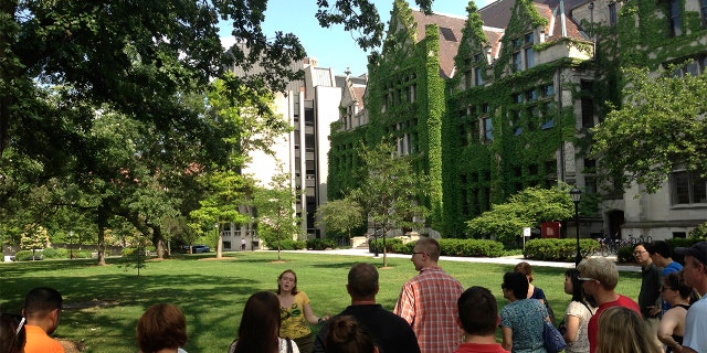 Prospective college students take a tour of the University of Chicago campus.