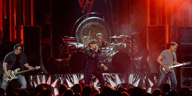 Left to right: Wolfgang Van Halen, David Lee Roth, Alex Van Halen and Eddie Van Halen of Van Halen perform during the 2015 Billboard Music Awards at MGM Grand Garden Arena on May 17, 2015 in Las Vegas, Nevada. (Photo by Ethan Miller/Getty Images)