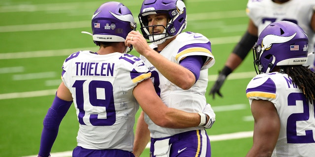 Minnesota Vikings wide receiver Adam Thielen (19) and Minnesota Vikings quarterback Kirk Cousins (8) celebrate after they conned on a pass for a touchdown against the Houston Texans during the second half of an NFL football game Sunday, Oct. 4, 2020, in Houston. (AP Photo/Eric Christian Smith)