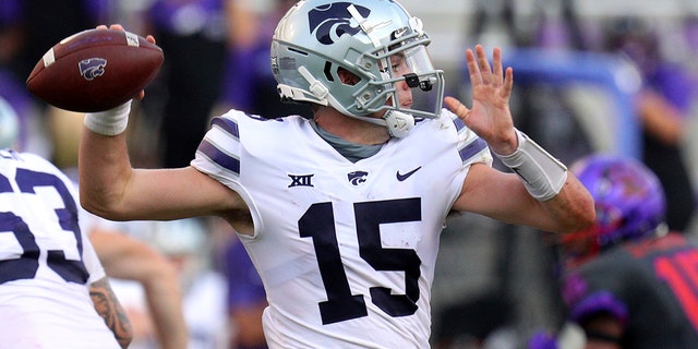 Kansas State quarterback Will Howard (15) looks for an open receiver in the fourth quarter of an NCAA college football game against TCU, Saturday, Oct. 10, 2020, in Fort Worth, Texas. (AP Photo/Richard W. Rodriguez)