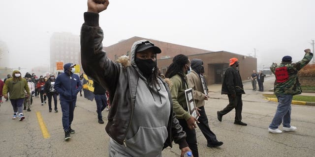 People march during a protest rally for Marcellis Stinnette who was killed by Waukegan Police last Tuesday in Waukegan, Ill., Thursday, Oct. 22, 2020. (AP Photo/Nam Y. Huh)