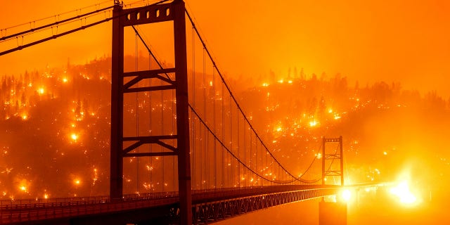 California faces 'critical' wildfire risk as heat wave builds, winds may 'hamper' containment efforts 2 In this Sept. 9, 2020, file image taken with a slow shutter speed, embers light up a hillside behind the Bidwell Bar Bridge as the Bear Fire burns in Oroville, Calif.