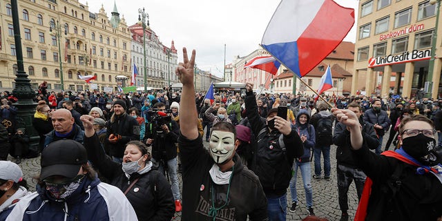 Demonstrators gather to protest the COVID-19 preventative measures downtown Prague, Czech Republic, on Wednesday. (AP Photo/Petr David Josek)