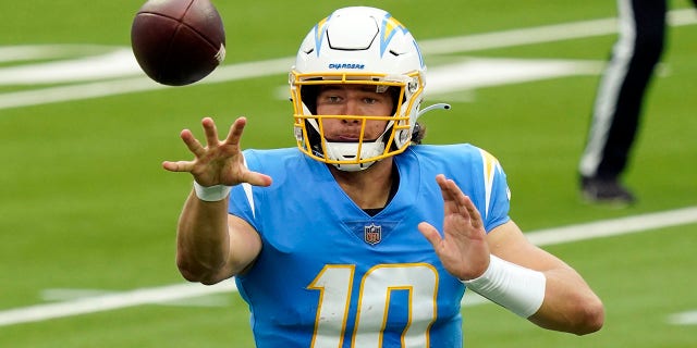 Los Angeles Chargers quarterback Justin Herbert pitches the ball during the first half of an NFL football game against the Jacksonville Jaguars Sunday, Oct. 25, 2020, in Inglewood, Calif. (AP Photo/Alex Gallardo)