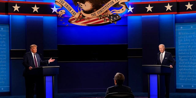 Moderator Chris Wallace of Fox News listens as President Donald Trump and Democratic candidate former Vice President Joe Biden participate in the first presidential debate Tuesday, Sept. 29, 2020, at Case Western University and Cleveland Clinic, in Cleveland, Ohio. (AP Photo/Patrick Semansky)