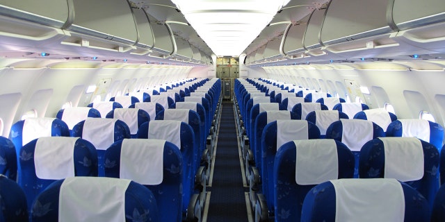 A Texas woman in her thirties died of the coronavirus during a commercial flight in July.