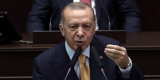 Turkey's President Recep Tayyip Erdogan addresses his ruling party lawmakers at the parliament, in Ankara, Turkey, Wednesday, Oct. 28, 2020. Erdogan threatened Wednesday to launch a new military operation in northern Syria if Kurdish militants are not cleared from areas along its border with Syria. He also said a Russian airstrike that targeted Turkey-backed Syrian rebels in Idlib earlier this week was an indication that Moscow was not looking for a lasting peace in the region. (AP Photo)