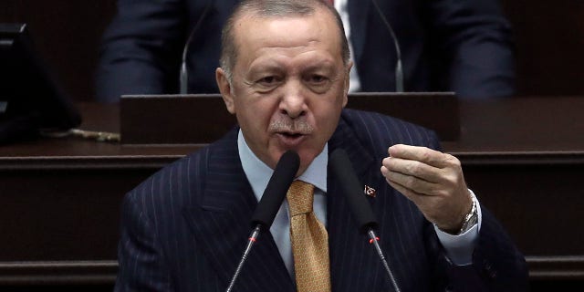 Turkey's President Recep Tayyip Erdogan addresses his ruling party lawmakers at the parliament, in Ankara, Turkey, Wednesday, Oct. 28, 2020. Erdogan threatened Wednesday to launch a new military operation in northern Syria if Kurdish militants are not cleared from areas along its border with Syria. He also said a Russian airstrike that targeted Turkey-backed Syrian rebels in Idlib earlier this week was an indication that Moscow was not looking for a lasting peace in the region. (AP Photo)