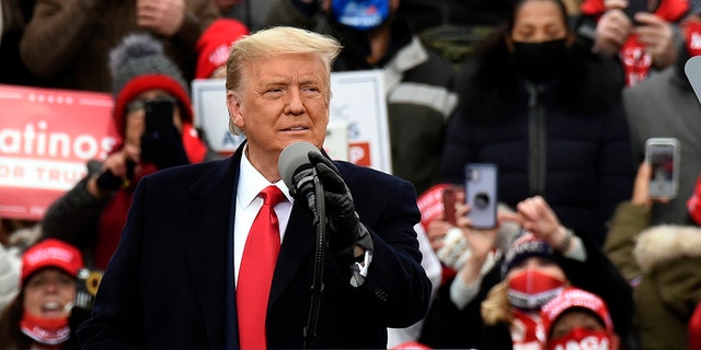 President Donald Trump addresses a campaign rally at Oakland County International Airport in Watford, Michigan, on Friday, October 30, 2020 (AP Photo/Jos Juarez)