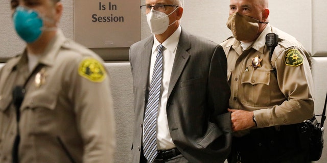UCLA Gynecologist Dr. James Heaps is taken into custody on Aug. 3, 2020, as he appears in Los Angeles Superior Court where additional charges were filed against him.