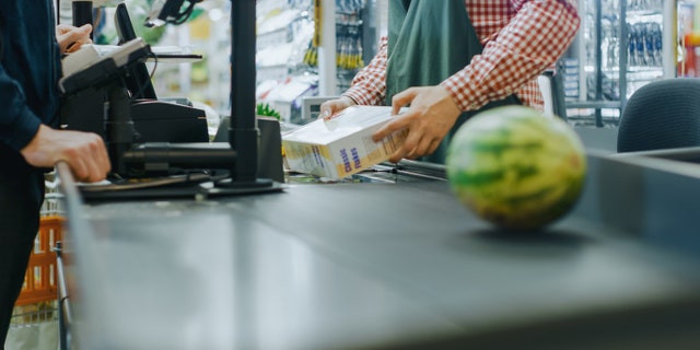 Workers who directly interacted with customers were five times more likely to test positive, per the study. (iStock)