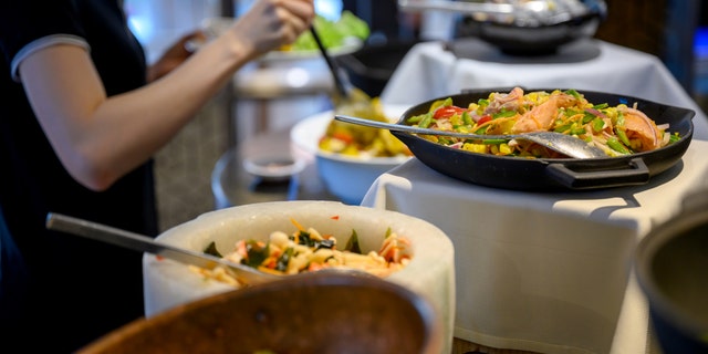 Family-style dinners, which involve guests passing platters of food around the table, should be avoided this Thanksgiving, Dr. Erika Schwartz says.