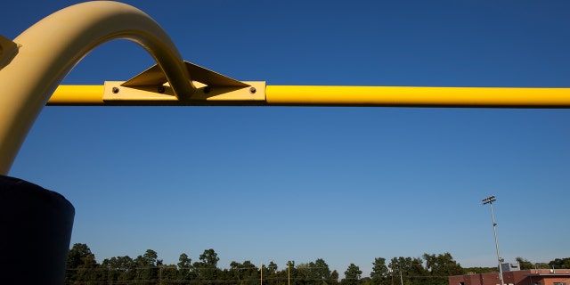 View from a closeup of a goal post on a high schools' football field