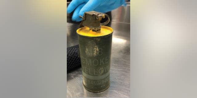 Investigators found the smoke grenade was still live despite the passenger claiming it was inert. (TSA)