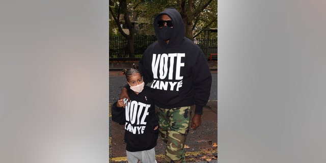 Kanye West and his daughter North wore 'Vote Kanye' sweatshirts while out in London on Friday.