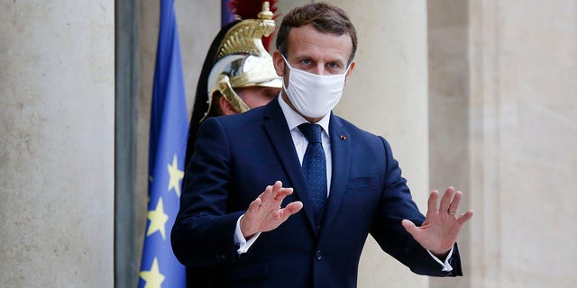 French President Emmanuel Macron was expected to announce new restrictions during a planned televised evening address to the nation later Wednesday. (AP Photo/Thibault Camus)