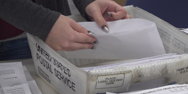 Election workers in Luzerne County - a swing county- are dealing with more mail-in ballots than ever.