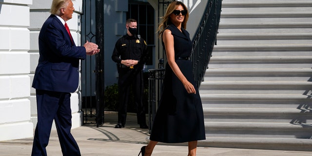 President Donald Trump and first lady Melania Trump walk to board Marine One on the South Lawn of the White House, Thursday, Oct. 22, 2020, in Washington. Trump is headed to Nashville, Tenn., for a debate. (AP Photo/Alex Brandon)