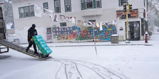 E. Snow fell on George Floyd Square at the intersection of 38th St. and Chicago Avenue. On Tuesday, October 20, 2020 in Minneapolis.