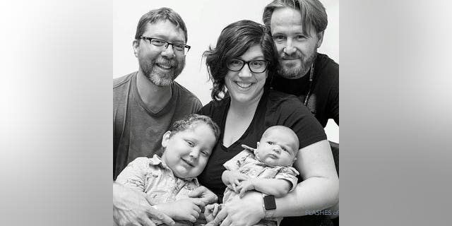 Lindsay Taylor (middle) is pictured with her ex-husband Chris Kelley (back left) and her current husband Mike Taylor (right) and two of her children, Lucas (front left) and Harrison.