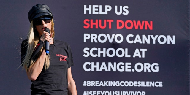 Paris Hilton speaks before leading a protest on Oct. 9, 2020, in Provo, Utah. Hilton was in Utah to lead a protest outside a boarding school where she alleges she was abused physically and mentally by staff when she was a teenager.