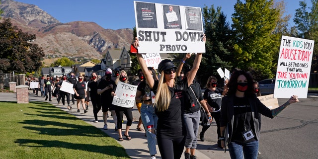 Paris Hilton, center, leads a protest Friday, Oct. 9, 2020, in Provo, Utah.