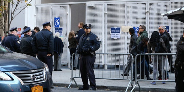 New York police take security measures as Republican presidential nominee Donald Trump arrives to vote at the Beckman Hill International School in New York City on Nov. 8, 2016. (Photo by Volkan Furuncu/Anadolu Agency/Getty Images)