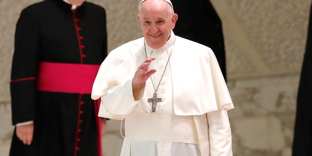 Pope Francis arrives in the Paul VI Hall at the Vatican for his weekly general audience on Wednesday. (AP Photo/Alessandra Tarantino)