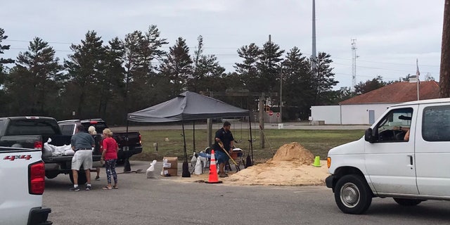 Officials in Orange Beach, Ala. were handing out sand and sand bags in preparation for Hurricane Delta.