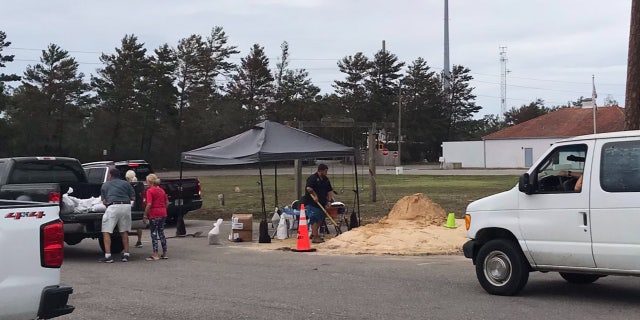 Officials in Orange Beach, Ala. were handing out sand and sand bags in preparation for Hurricane Delta.