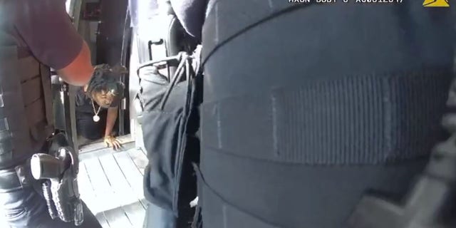 Snead followed the victim out of his apartment on his hands and knees. He was arrested outside after the woman was taken to safety.