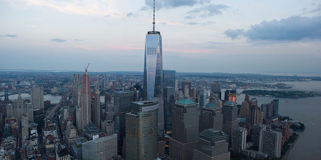 One World Trade Center stands the Lower Manhattan skyline at dusk in this aerial photograph taken above New York, U.S. Photographer: Craig Warga/Bloomberg via Getty Images