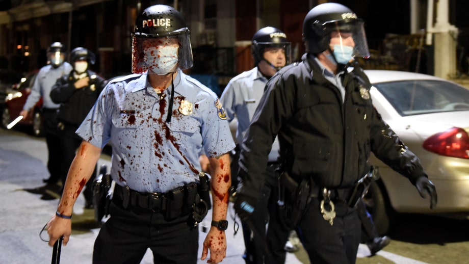 Philadelphia reels from second night of unrest, nearly a dozen shot as victim's family pleads for peace