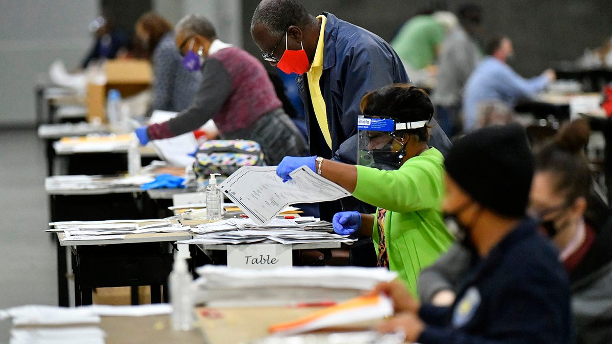 Election workers in Fulton County began working through a recount of ballots Saturday, Nov. 14, 2020 in Atlanta. (Associated Press)