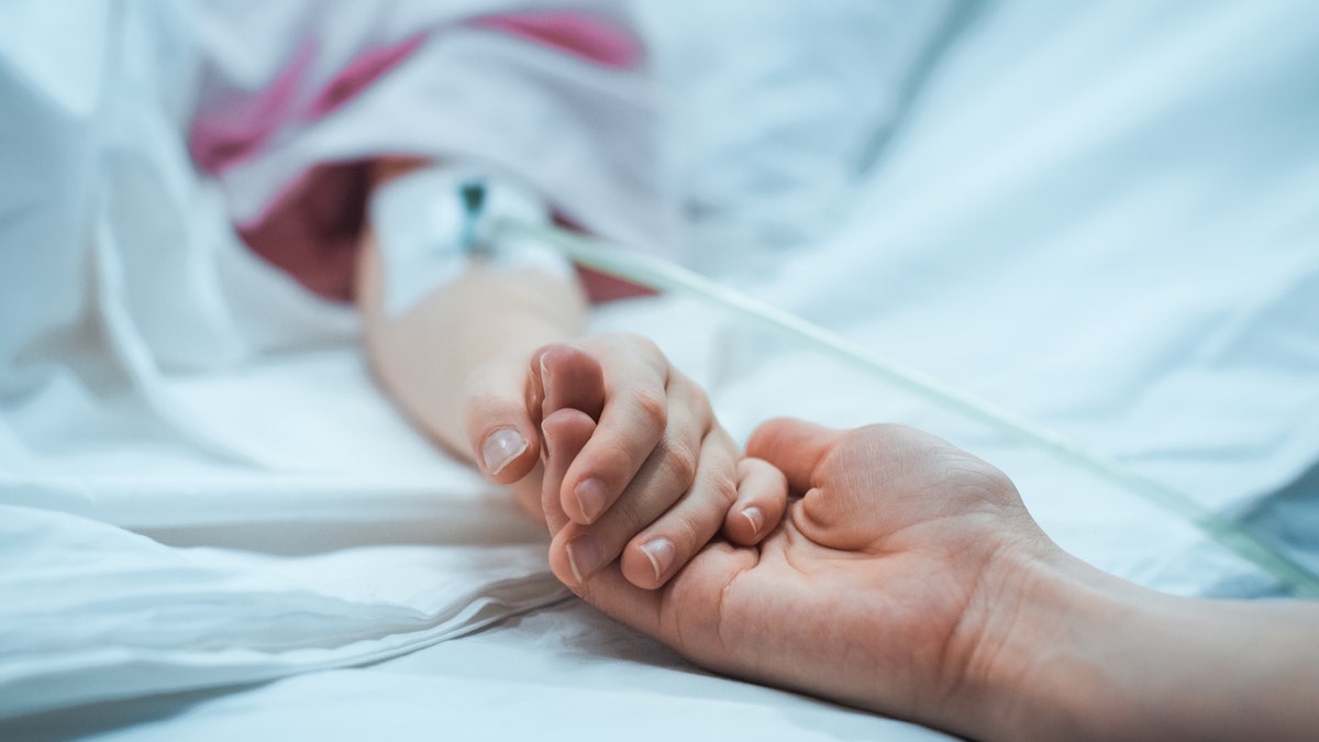 child in hospital bed